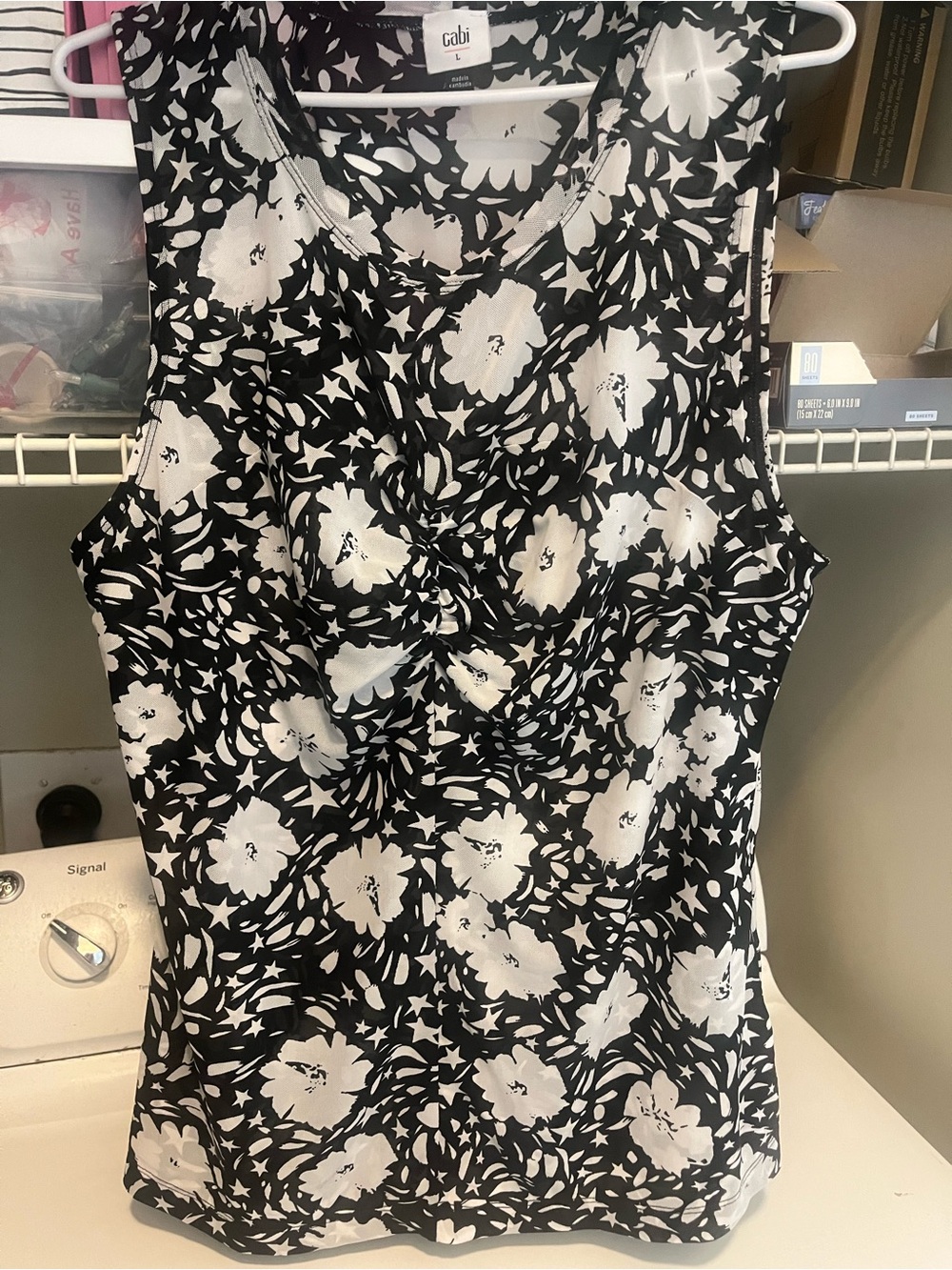 CAbi size large women’s floral black and white sleeveless blouse